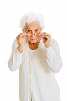 photo of white haired older woman in white clothing