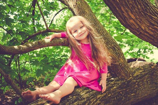 girl on tree limb