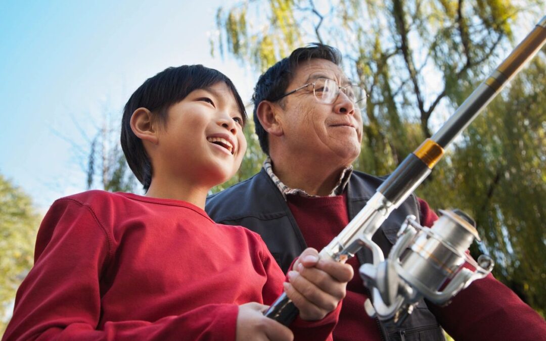 man with son with rod and reel